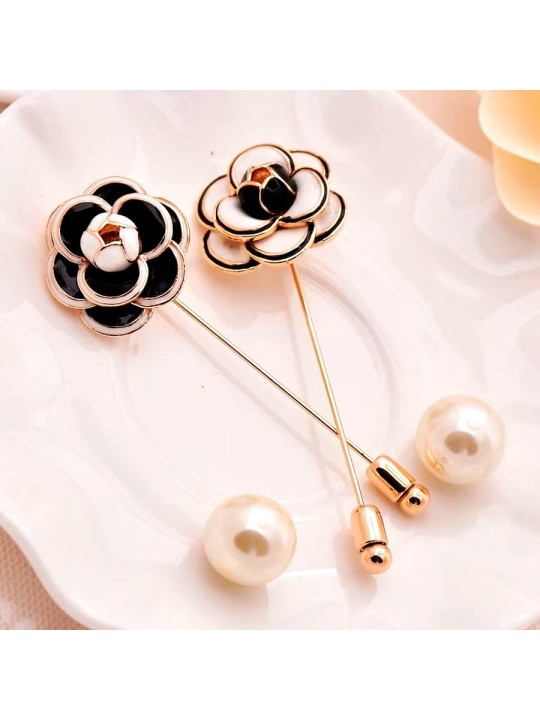 Broche aguaja camelia negra y blanca